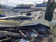In via Astico alcune lamiere sono volate contro delle auto in sosta In via Astico alcune lamiere sono volate contro delle auto in sosta