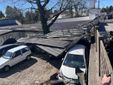 In via Astico alcune lamiere sono volate contro delle auto in sosta In via Astico alcune lamiere sono volate contro delle auto in sosta