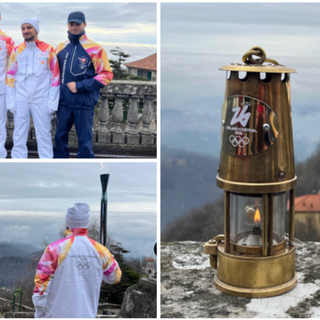 Il vicesindaco Ivana Perusin con i tedofori e la fiamma olimpica al Sacro Monte