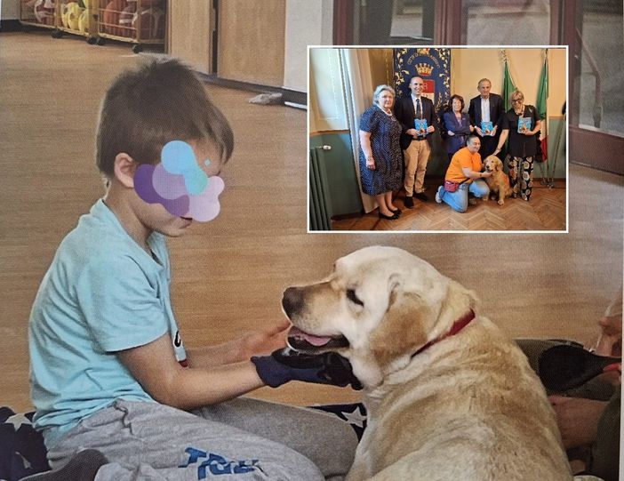Una delle immagini che illustrano il libro dedicato ad Aut-Out. Nel riquadro, la conferenza stampa con la golden retriever Giada Una delle immagini che illustrano il libro dedicato ad Aut-Out. Nel riquadro, la conferenza stampa con la golden retriever Giada