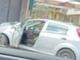 L'auto finita contro la saracinesca in via Varese (foto da un lettore) L'auto finita contro la saracinesca in via Varese (foto da un lettore)