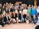 Una parte dei 98 infermieri premiati e, sotto, il presidente dell’Ordine delle Professioni Infermieristiche di Varese Salvatore Santo
