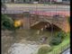 Un'auto, di cui si intravede il tetto, trasportata dalla furia dell'acqua nel Saronnese (foto tratta da IlSaronno.it)