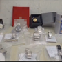 Orologi e carte da collezione di contrabbando sequestrati all'aeroporto di Linate
