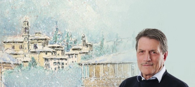 Ercole Cattaneo con la copertina del suo libro su Besozzo