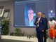 Renzo Oldani, presidente della Società Ciclistica Binda, e dietro il ministro dell'Economia Giancarlo Giorgetti, collegato in video