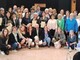 Una parte dei 98 infermieri premiati e, sotto, il presidente dell’Ordine delle Professioni Infermieristiche di Varese Salvatore Santo